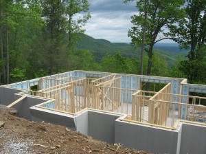 view over a framed in basement towards mountains, no house built (yet)
