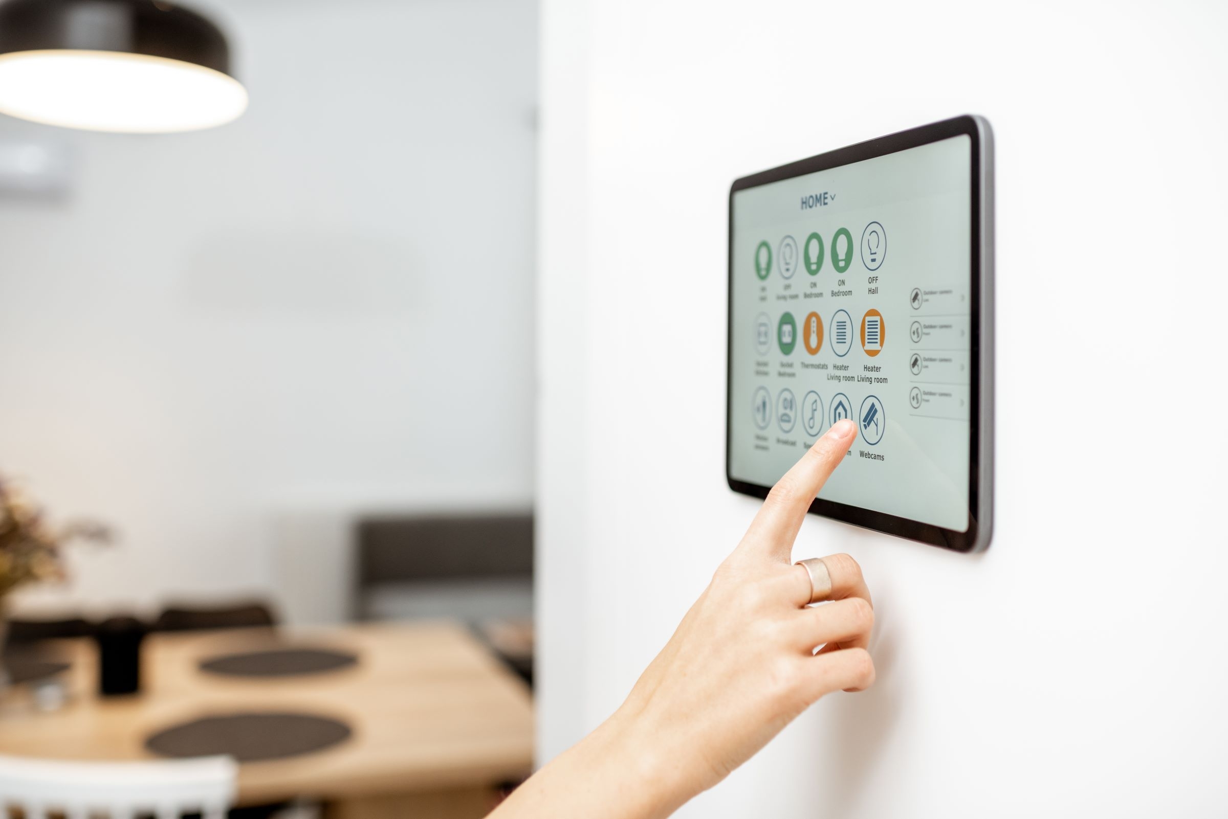 woman using tablet with smart home technology software woman using tablet with smart home technology software